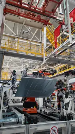 Robotic production line at an automotive factory visited by Flawless Effect