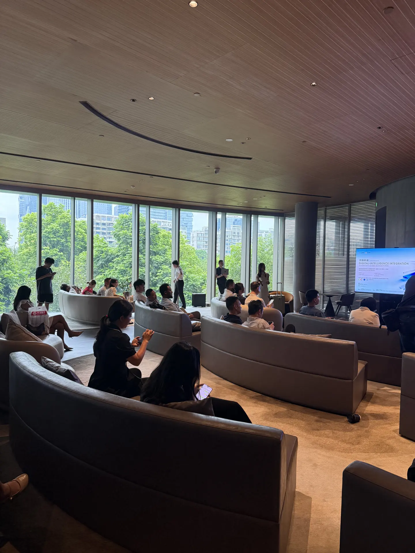 International buyers seated in a lounge in Guangzhou listening to a briefing