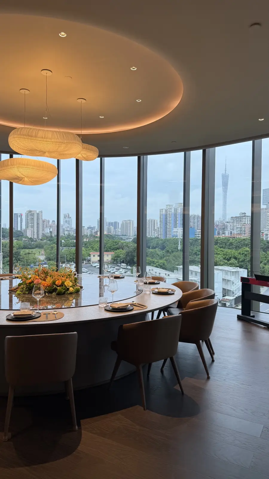 Flawless Effect meeting and dining space in Guangzhou with the city skyline behind